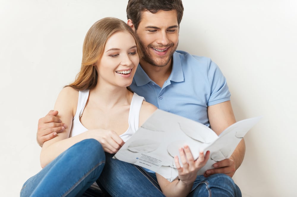couple reading magazine